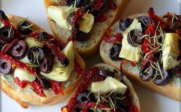 Artichoke, Kalamata, & Sun-Dried Tomato Mini-Pizzas With Garlic and Rosemary