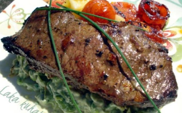 Strip steak with roasted cherry tomatoes and vegetable mash